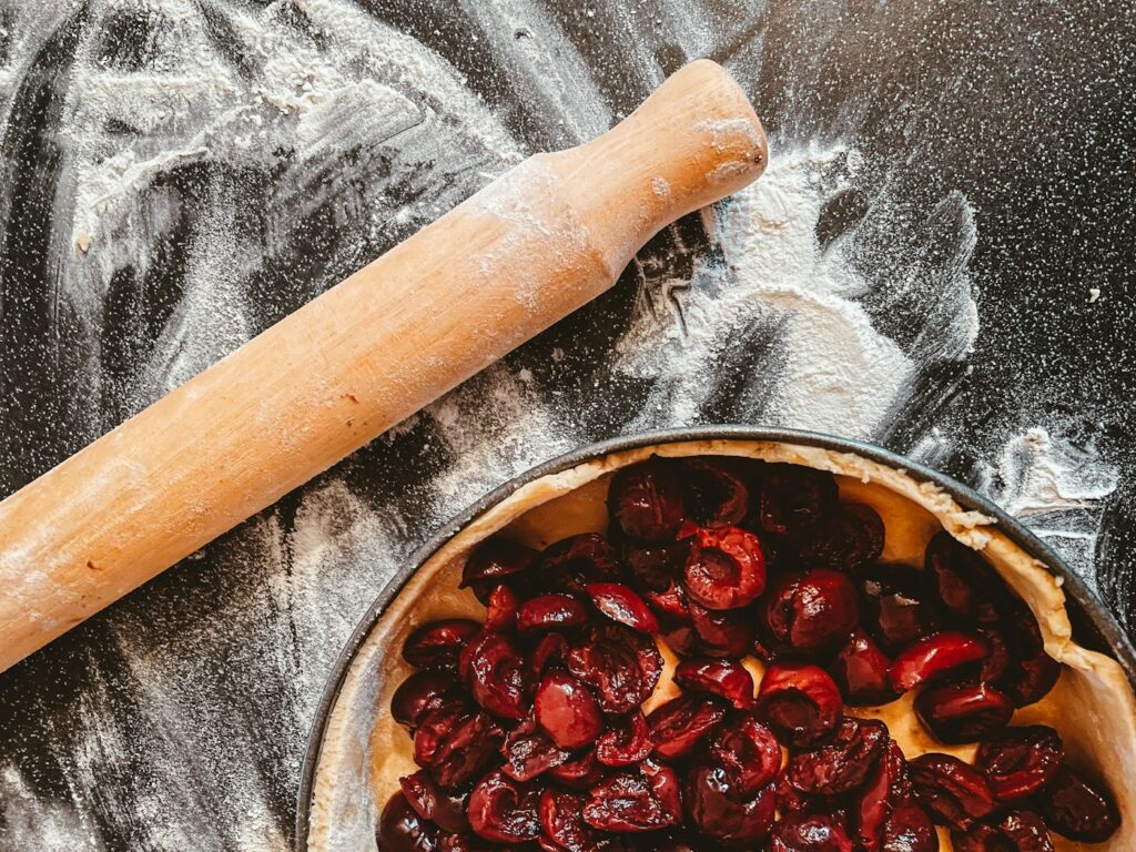 A rolling pin and bowl for baking